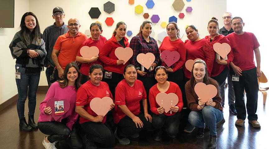 Valentine's PET Frames event group photo in red and pink shirts