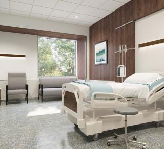 Patient room with wood wall and Walnut Seem 1 wall mount luminaires over chair and patient bed