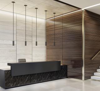 ID+ 2.5" Pure Cylinders 8" height in black over a reception desk