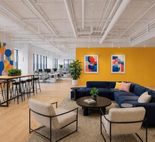 Colorful Open office featuring ID+ 2.5" Cylinders, 8" white pendants used as ambient, task and wall wash