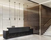 ID+ 2.5" Pure Cylinders 8" height in black over a reception desk