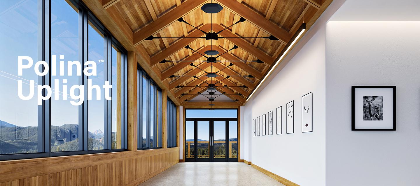 Polina Uplight adds soft glow to a vaulted corridor with wood beam ceiling